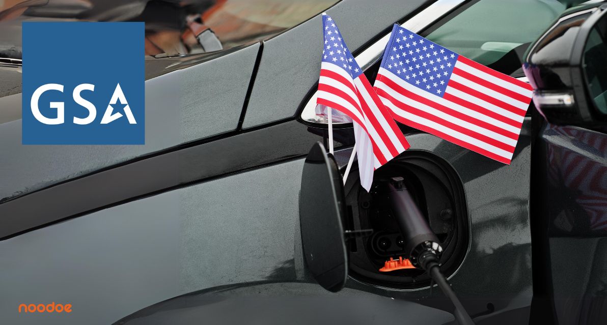 Government electric fleet vehicle with US federal flag charging from an EV charging station